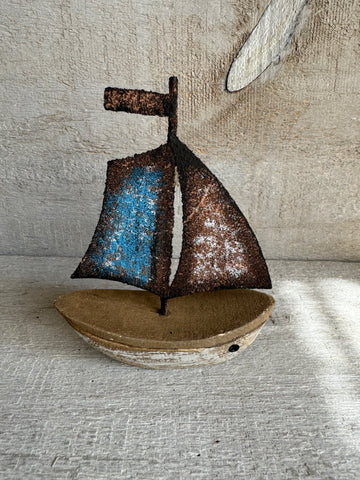 Mini Sailboat with sail up.