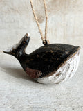 Black carved whale ornament