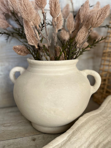 The ecru paper mache vase