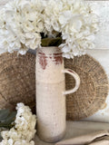 The textured terracotta jug vase
