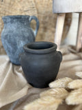The burnt terracotta pot
