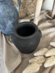 The burnt terracotta pot