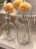 The clear glass bud vase