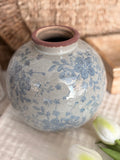 The round vintage floral vase