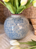 The round vintage floral vase