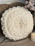 The round flower stitched pillow