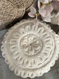 The round flower stitched pillow