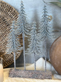 Snow dusted trees on a log