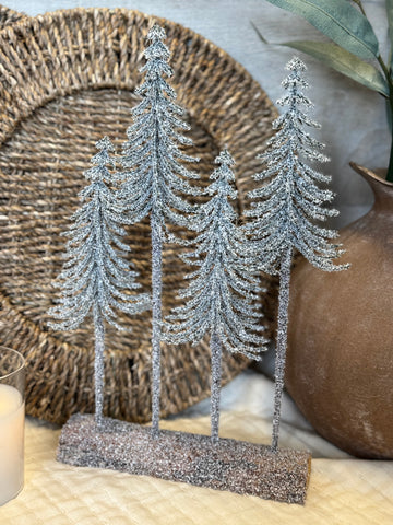 Snow dusted trees on a log