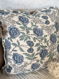 Handwoven floral fringe pillow