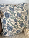 Handwoven floral fringe pillow