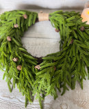 Real touch pinecone heart wreath 22”