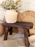 The dark wood stool