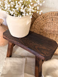 The dark wood stool