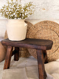 The dark wood stool