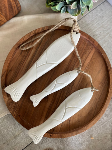 The hanging white wood fish