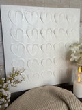 The textured white heart canvas