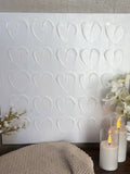 The textured white heart canvas