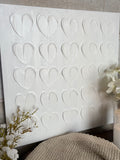 The textured white heart canvas