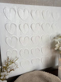 The textured white heart canvas