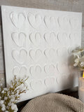 The textured white heart canvas