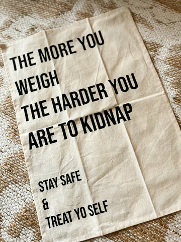 The more you weigh the harder you are to kidnap tea towel