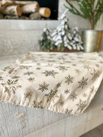 The gold snowflake table runner