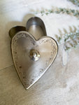 The tin heart container